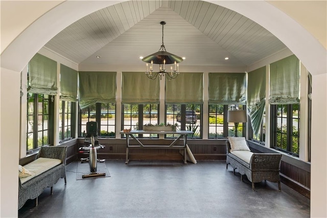 sunroom with vaulted ceiling and wooden ceiling