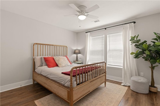 bedroom featuring ceiling fan and dark wood-type flooring