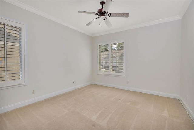 unfurnished room featuring baseboards, light colored carpet, ornamental molding, and ceiling fan