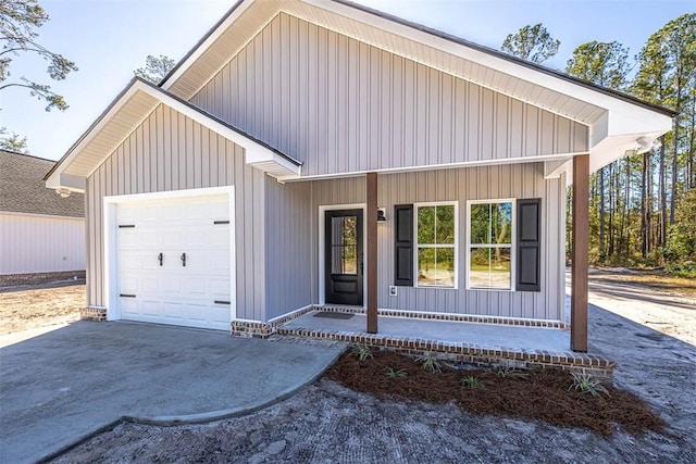 view of front facade with a porch and a garage