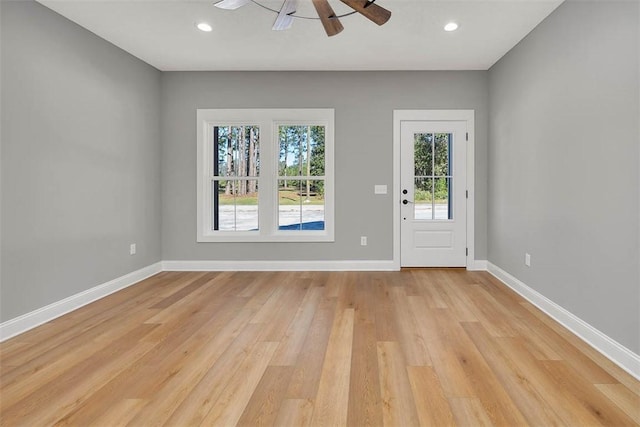 interior space with ceiling fan and light hardwood / wood-style flooring