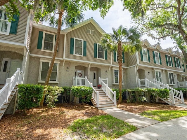 1106 Plantation Point Dr, Saint Simons Island, GA 31522 - townhome / multi-family property featuring stucco siding