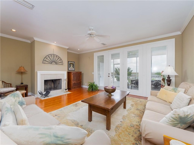 1106 Plantation Point Dr, Saint Simons Island, GA 31522 - living area with light wood finished floors, a ceiling fan, ornamental molding, recessed lighting, and a fireplace