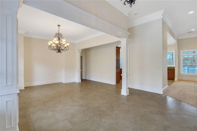 empty room with an inviting chandelier, ornamental molding, and ornate columns