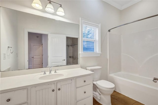 full bathroom featuring vanity, tile patterned floors, toilet, and bathtub / shower combination