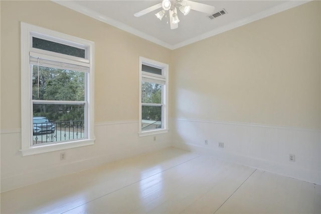 unfurnished room featuring crown molding and ceiling fan