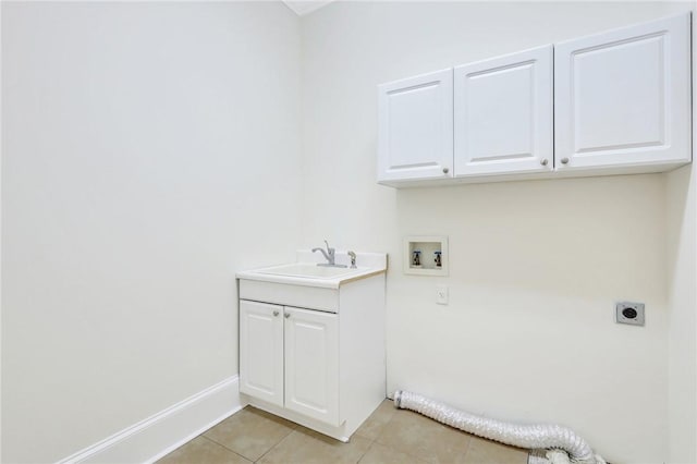 laundry room featuring light tile patterned flooring, sink, cabinets, washer hookup, and hookup for an electric dryer