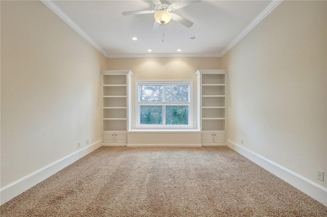 carpeted empty room featuring ornamental molding and ceiling fan