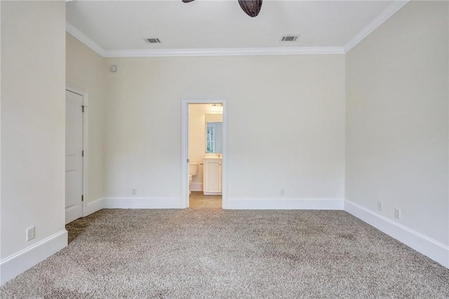 empty room with crown molding, light colored carpet, and ceiling fan