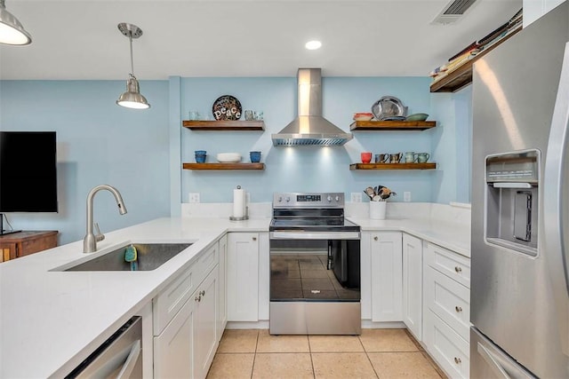 1000 Mallery Street Ext Unit G62, Saint Simons Island, GA 31522 - kitchen with appliances with stainless steel finishes, wall chimney range hood, open shelves, a sink, and recessed lighting