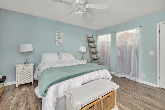 1000 Mallery Street Ext Unit G62, Saint Simons Island, GA 31522 - bedroom featuring wood finished floors, baseboards, a ceiling fan, and a textured ceiling