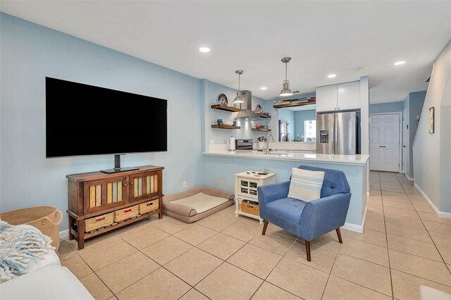 1000 Mallery Street Ext Unit G62, Saint Simons Island, GA 31522 - living room with light tile patterned floors, baseboards, and recessed lighting