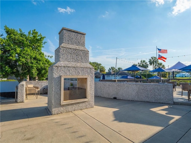 104 Colony Pl, Saint Simons Island, GA 31522 - view of patio with a glass covered fireplace