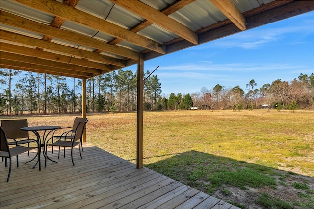 544 Lud Oquinn Rd, Odum, GA 31555 - deck with a lawn, view of scattered trees, and outdoor dining space