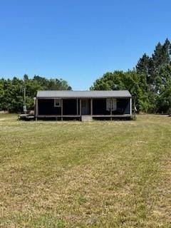 544 Lud Oquinn Rd, Odum, GA 31555 - back of property featuring a lawn