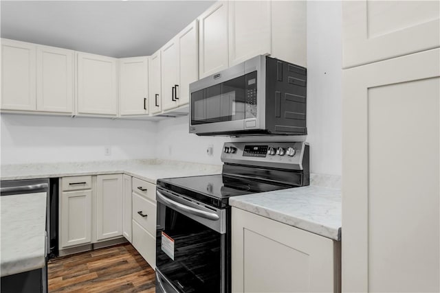 544 Lud Oquinn Rd, Odum, GA 31555 - kitchen featuring stainless steel appliances, white cabinetry, dark wood-style flooring, and light stone counters