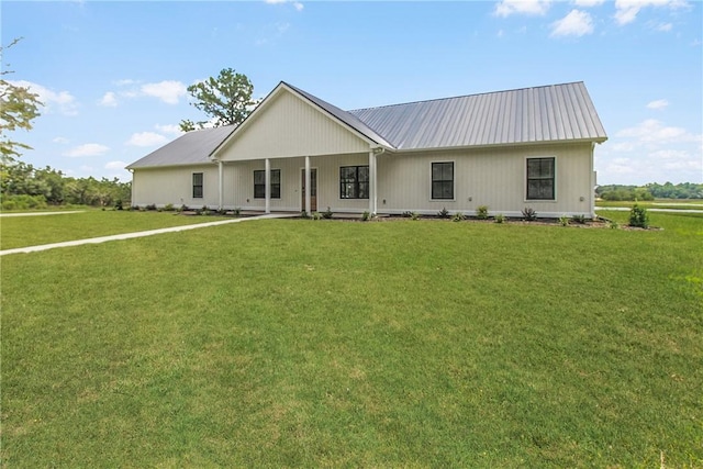 view of front facade with a front lawn and a porch