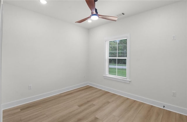 empty room featuring light hardwood / wood-style flooring and ceiling fan