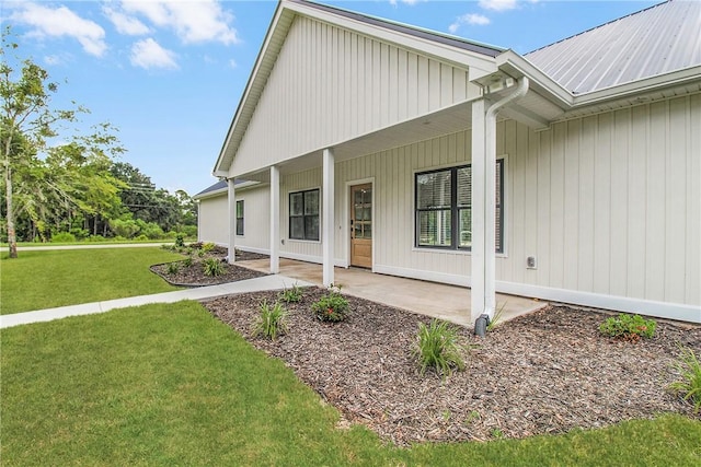 exterior space with a lawn and covered porch