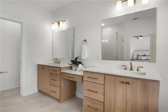 bathroom featuring ceiling fan, walk in shower, and vanity