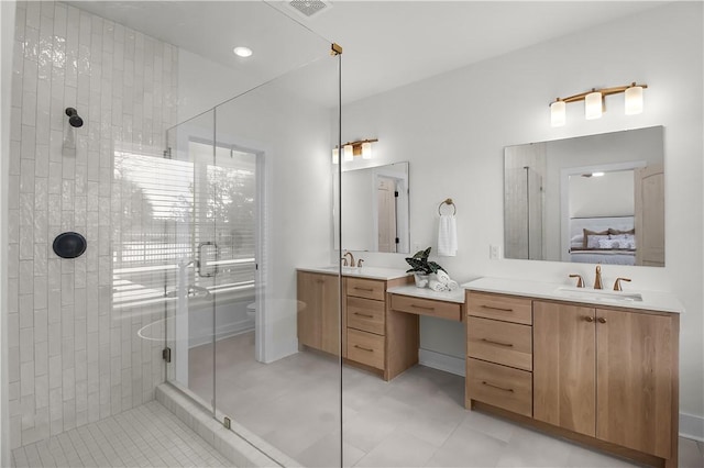 bathroom featuring vanity, an enclosed shower, and toilet