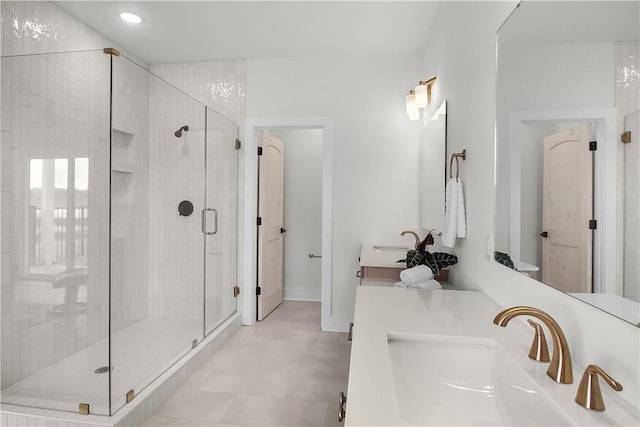 bathroom featuring vanity and a shower with shower door