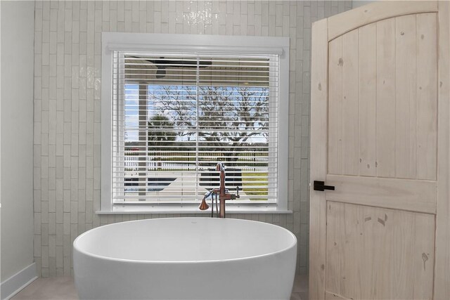 bathroom featuring a bath