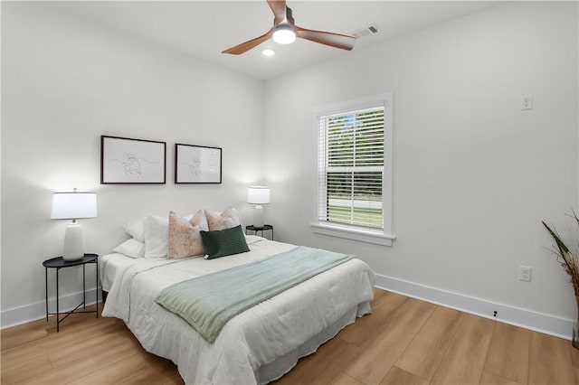 bedroom featuring hardwood / wood-style flooring and ceiling fan