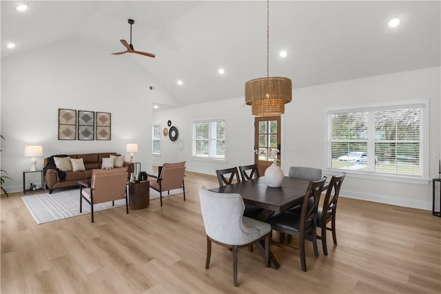 dining area with light hardwood / wood-style floors, plenty of natural light, and ceiling fan