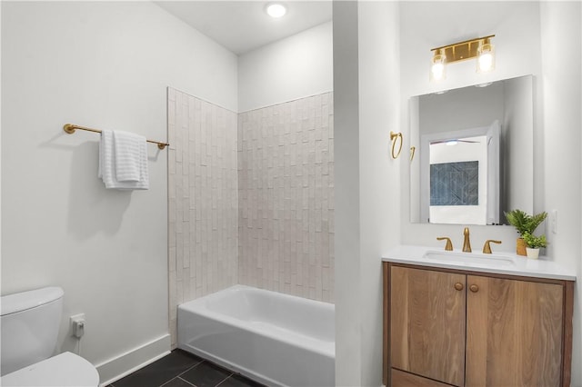 full bathroom with tile patterned floors, vanity, toilet, and tiled shower / bath combo