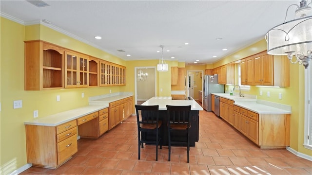 500 Altamaha Rd, Jesup, GA 31545 - kitchen featuring a kitchen island, recessed lighting, appliances with stainless steel finishes, light countertops, and a kitchen breakfast bar
