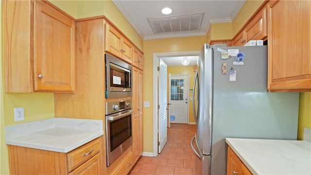500 Altamaha Rd, Jesup, GA 31545 - kitchen featuring appliances with stainless steel finishes, ornamental molding, light countertops, light tile patterned floors, and light brown cabinetry