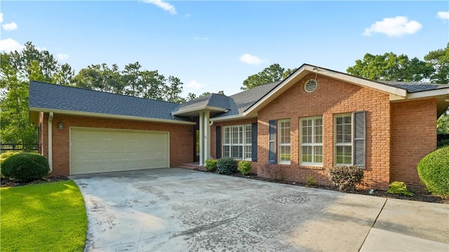 500 Altamaha Rd, Jesup, GA 31545 - ranch-style home featuring driveway, brick siding, an attached garage, and roof with shingles