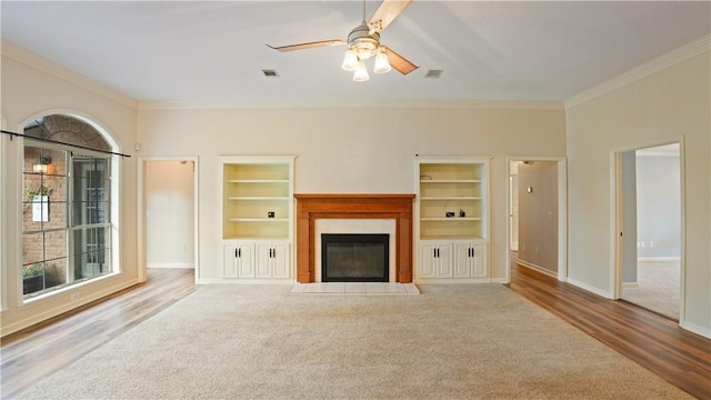 500 Altamaha Rd, Jesup, GA 31545 - unfurnished living room with ornamental molding, a fireplace, built in shelves, ceiling fan, and wood finished floors