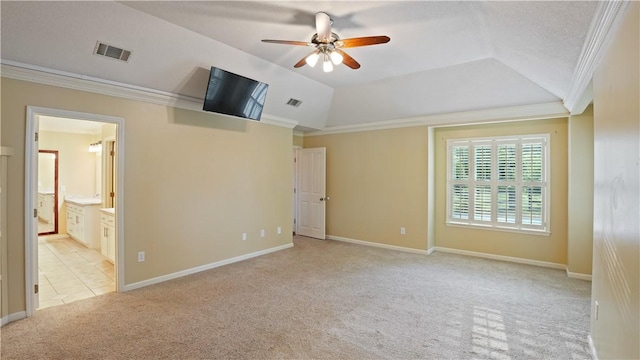 500 Altamaha Rd, Jesup, GA 31545 - unfurnished bedroom with carpet, ornamental molding, vaulted ceiling, connected bathroom, and ceiling fan