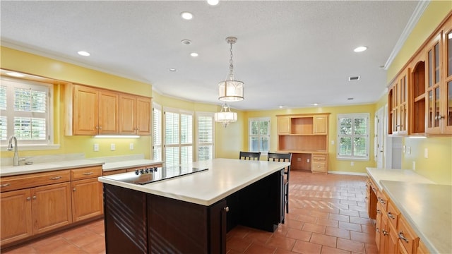 500 Altamaha Rd, Jesup, GA 31545 - kitchen featuring healthy amount of natural light, light countertops, ornamental molding, recessed lighting, and glass insert cabinets