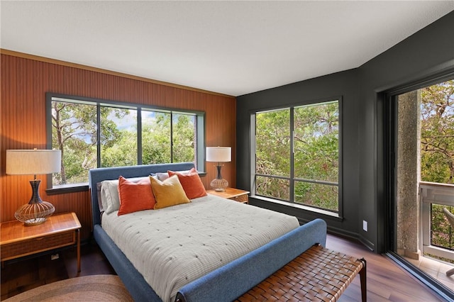 1332 Oak St Unit 9, Saint Simons Island, GA 31522 - bedroom featuring wooden walls and wood finished floors