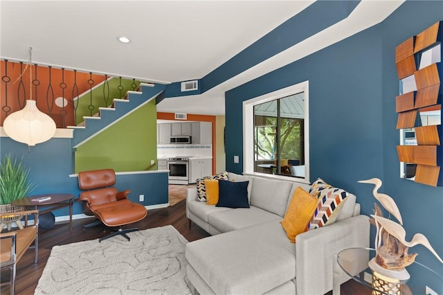 1332 Oak St Unit 9, Saint Simons Island, GA 31522 - living room with wood finished floors, stairway, and recessed lighting