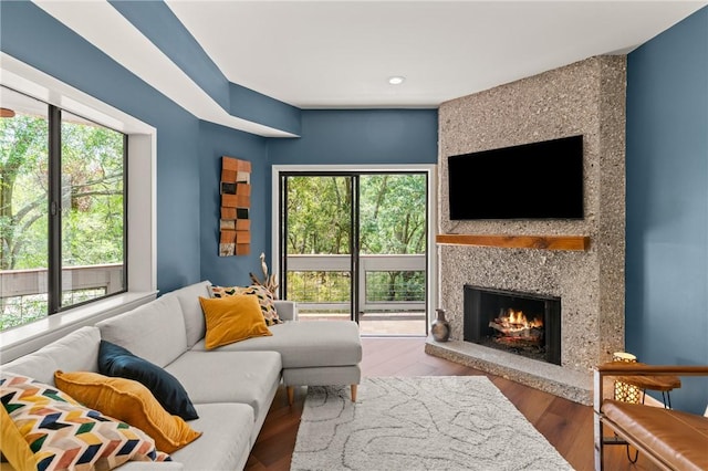 1332 Oak St Unit 9, Saint Simons Island, GA 31522 - living area with a large fireplace, wood finished floors, and recessed lighting