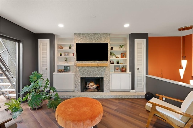 1332 Oak St Unit 9, Saint Simons Island, GA 31522 - living area featuring wood finished floors, a fireplace, built in features, and recessed lighting