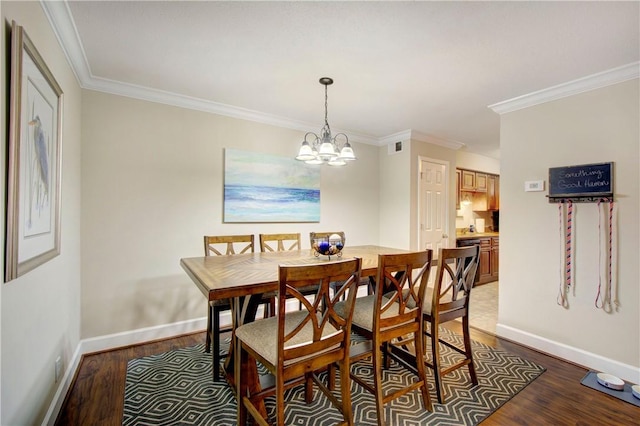 dining room featuring visible vents, baseboards, dark wood-style flooring, crown molding, and a chandelier