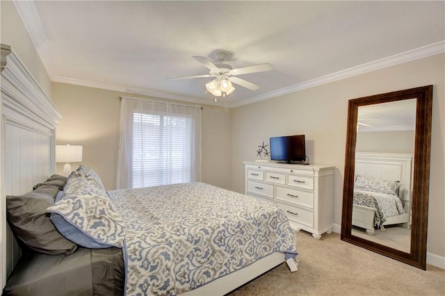 bedroom with a ceiling fan, light colored carpet, baseboards, and ornamental molding