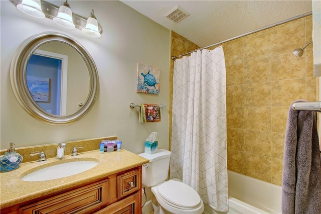 bathroom featuring visible vents, toilet, vanity, and shower / tub combo with curtain