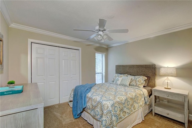 carpeted bedroom with crown molding, a ceiling fan, a closet, and a textured ceiling