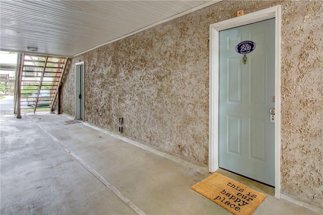 entrance to property with stucco siding