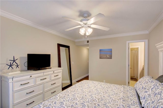 bedroom with baseboards, visible vents, ceiling fan, ensuite bathroom, and crown molding