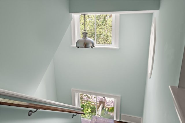 stairway featuring a wealth of natural light