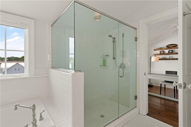 full bath with a stall shower and a garden tub