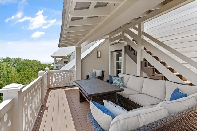 wooden terrace featuring an outdoor hangout area
