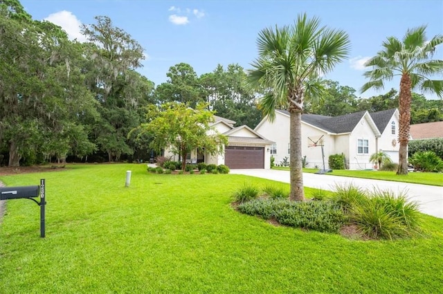 view of front facade with a front yard and a garage